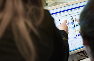 Researchers browsing genome database