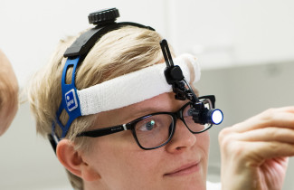 Medical student examining a patient.