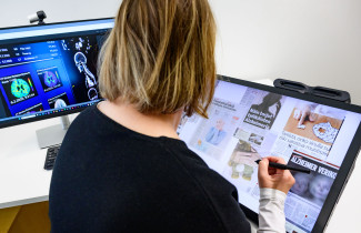 Person looking at a computer screen.
