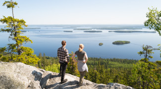 Students at Koli, scenery to the lake