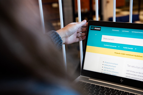 Woman working on a computer.