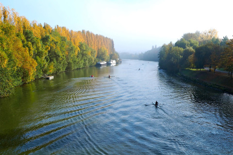 Canoes in the autumn river landscape.