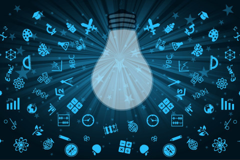 piirrokuvassa kymmeniä erilaisia symboleita hehkulampun ympärillä