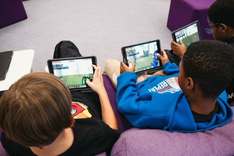 Students with tablets in elementary school.