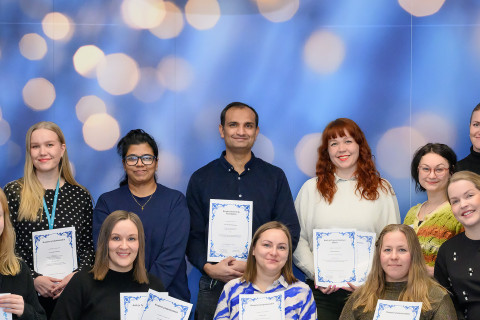 Grant recipients in a group photo with representatives of the Kuopio University Foundation.