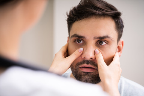 Physician Doctor Doing Sinusitis Examination.