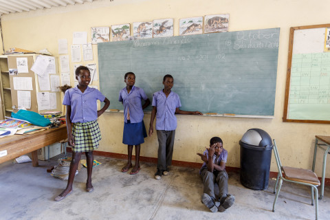Namibian schoolchildren wait for class to begin in the classroom.