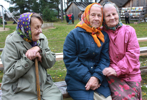Photo of old Russian women sitting on a bench.
