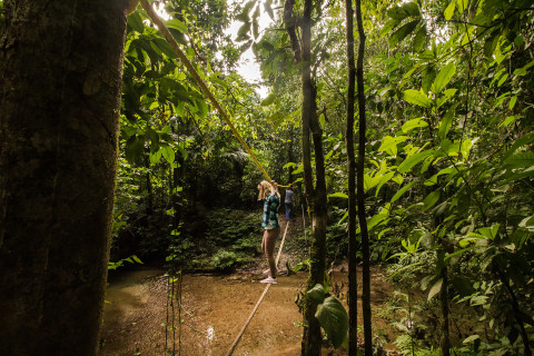 People crossing the river by cableway