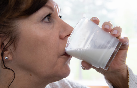 Woman drinking dairy product