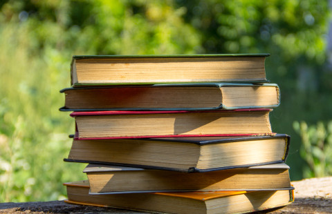 Stack of books on table.