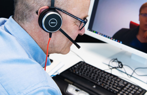 Man giving video feedback to a student.