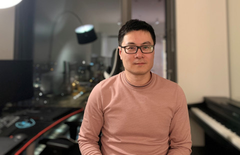 Man with glasses and dark hair looking at the camera.
