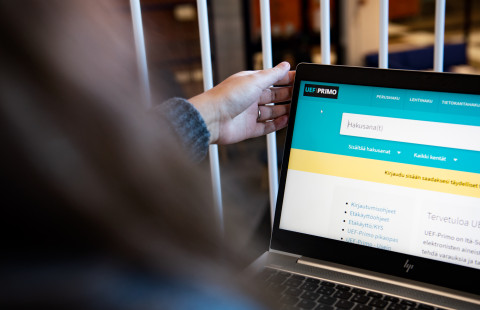 Woman working on a computer.