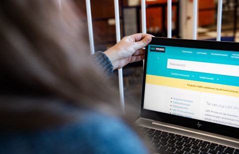 Woman working on a computer.