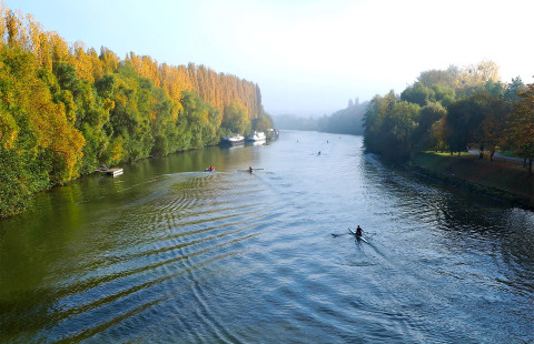 Canoes in the autumn river landscape.