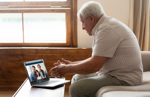 Elderly man with laptop.