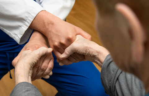 Doctor inspecting an elderly patient.