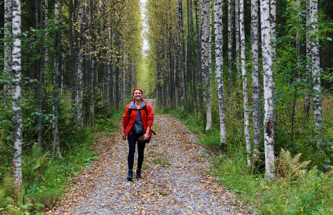 Woman walking in forest