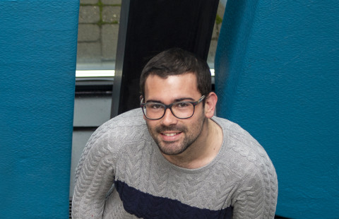 Student wearing glasses and smiling
