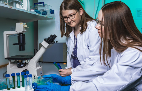Two women working in a laboratory.