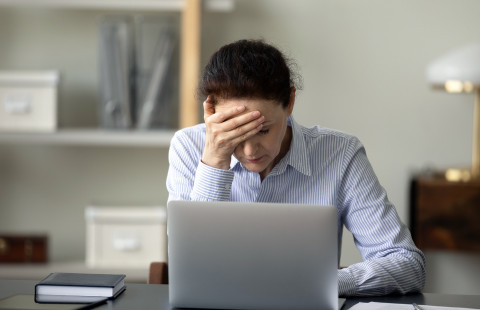 Tired woman at work.