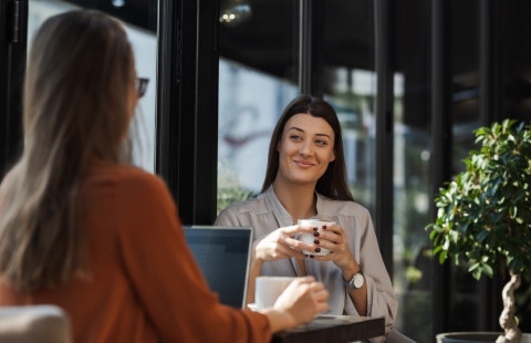 Two person in a cafe.
