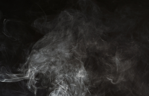 Gray smoke on black background.