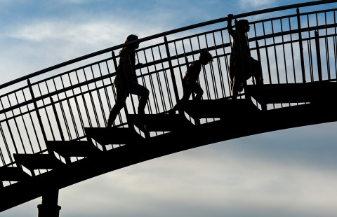 Children climbing up steps.