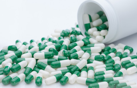 Green and white capsule pills.