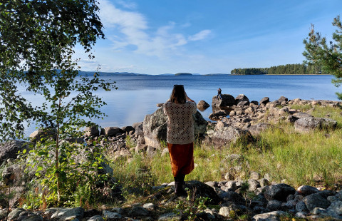Two people on the shoreline.