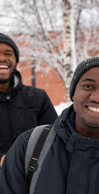 Two international students smiling